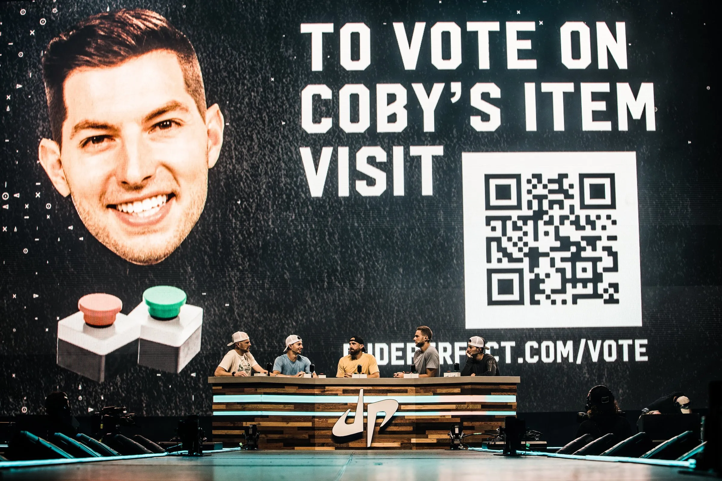 On-stage moment — interactive audience vote screen with QR code
