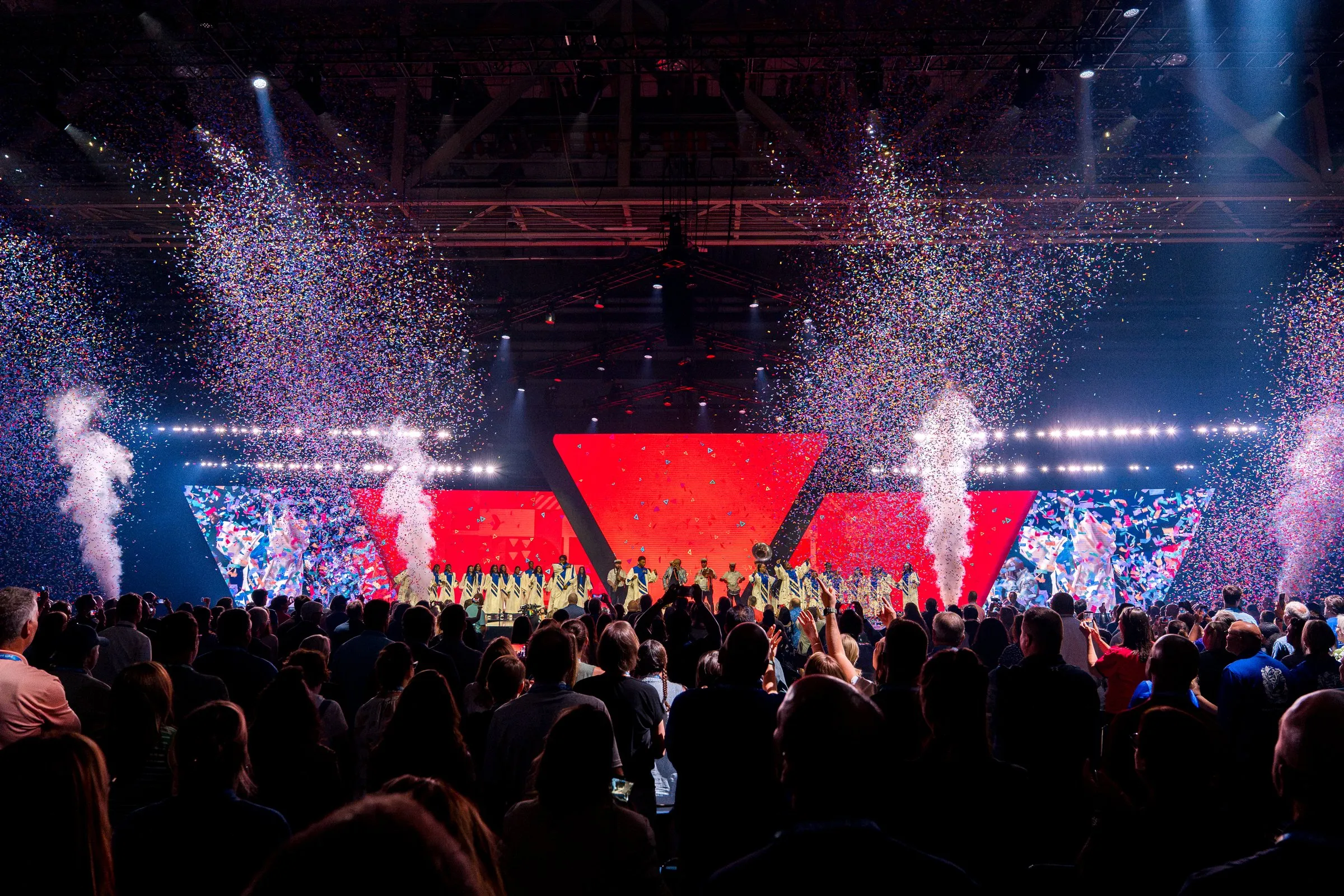YMCA General Assembly 2026 — confetti finale in front of the red triangle LED build in New Orleans
