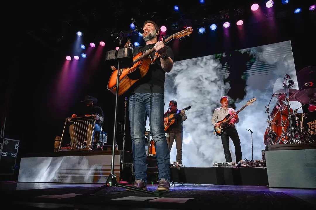 Josh Turner — wide stage view with full band, smoke and cloud LED treatment on the back wall, full lighting rig overhead